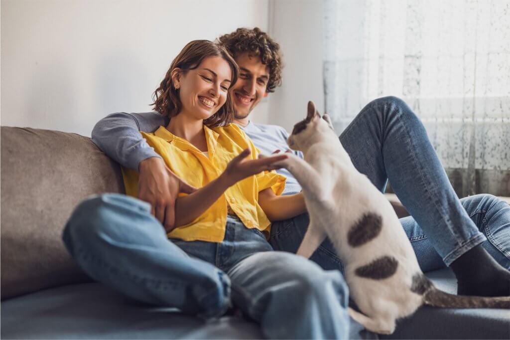 a couple with a cat at pet-friendly plano texas apartments